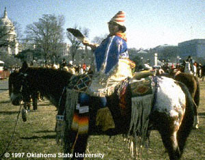 Appaloosa horse and rider dressed in tribe attire.